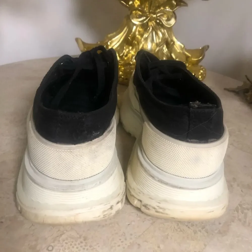 Alexander McQueen black and white platform chucks.